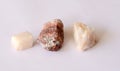 Close up of various yellow, white and pink sparkling quartz stones