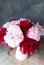 Close-up Vase of bouquet of beautiful peonies on table in room, close-up. Bloom. Peony. Postcard. Spring summer mood. Royalty Free Stock Photo