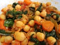 Spinach and chickpea stew on a white plate
