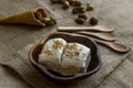 Vegan vanilla ice cream in bamboo bowl with wooden spoons Royalty Free Stock Photo