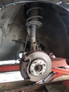 Close-up vehicle axle inspection, disc brake