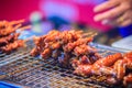 Close up the vendor grilling pork satay, Thai steak roasted pork Royalty Free Stock Photo