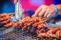 Close up the vendor grilling pork satay, Thai steak roasted pork Royalty Free Stock Photo