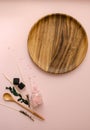 Close-up vertical Flat Lay SPA objects: sea salt, wooden spoons, white and pink shells, rose flowers buds and leaves, Wooden Royalty Free Stock Photo