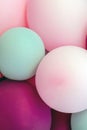 Close-up vertical image of balloons of various pleasant colors. Congratulations, celebrations, birthdays