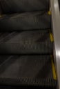 Close up vertical shot of upper stairs of escalator Royalty Free Stock Photo