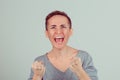 Close up very angry woman screaming in horror, grimace portrait. Stressed frustrated young lady having nervous breakdown isolated Royalty Free Stock Photo