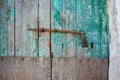 Close-up of very old grungy wooden weathered doors with door handle Royalty Free Stock Photo