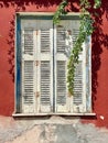 Close-up of very old grungy wooden weathered window shutters on the island Zakynthos in Greece Royalty Free Stock Photo