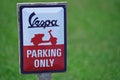 Vespa motorcycle Parking Only Sign