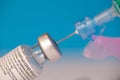 Close up of vial of Pfizer - BioNTech COVID-19 vaccine for coronavirus with a syringe