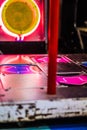 Close-Up of a Vibrant Dance Arcade Game Machine with Illuminated Arrows and Neon Lights in a Nostalgic Arcade Environment Creating Royalty Free Stock Photo