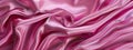 Close up of a vibrant pink satin fabric with a silky texture Royalty Free Stock Photo