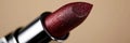 Close up of vibrant red lipstick with glossy finish on neutral backdrop, in stunning macro shot