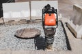 Close-up of a vibrating rammer on the road Royalty Free Stock Photo