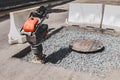 Close-up of a vibrating rammer on the road Royalty Free Stock Photo