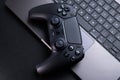 Close Up of Video Game Controller Near Laptop