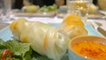 Close-up vietnamese spring rolls nem goi cuon on table in restaurant