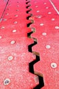 Close up view from above of an red iron dilatation joint placed Royalty Free Stock Photo