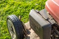 Close-up view of an air filter compartment seen on a petrol powered lawn mower.