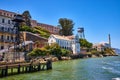 Close up view of Alcatraz Island shoreline lined with buildings and prison