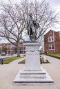 Close-up view of the Alexander Hamilton statue in New Jersey, set against a backdrop of bare trees and urban architecture. Royalty Free Stock Photo