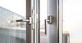 Close up view of aluminum door window, blurry background Royalty Free Stock Photo