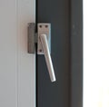 Close up view of aluminum door window handle Royalty Free Stock Photo