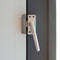 Close up view of aluminum door window handle Royalty Free Stock Photo