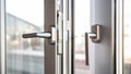 Close up view of aluminum door window handles, against a blurry Royalty Free Stock Photo