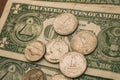 Close up view of American dollar bills and coins as background. Heap of American dollars for design.