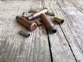 Close up view of ammunition casings on a wood background