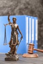 Close-up view of antique statue of lady justice on wooden table Royalty Free Stock Photo