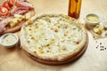Close Up View On Appetizing 4 Cheese Pizza With Pear On Wooden Background In A Restaurant. Italian Cuisine