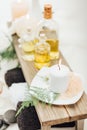 close up view of arrangement of spa treatment accessories with essential oil, salt and candle Royalty Free Stock Photo