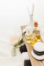 close up view of arrangement of spa treatment accessories with fern plant, towels, oil and salt Royalty Free Stock Photo