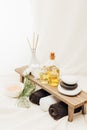 close up view of arrangement of spa treatment accessories with towels, oil and salt Royalty Free Stock Photo