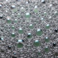 A close-up view of an array of soap bubbles, forming a complex pattern of hexagonal Royalty Free Stock Photo