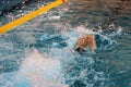 Close up view at athletic young man freestyle swimming in the pool, sport and healthy lifestyle concept. Swimmer swimming with