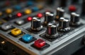 Close-Up View of Audio Mixer Control Panel with Colorful Knobs Royalty Free Stock Photo