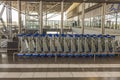 Close up view of baggage carts at airport parking place. Royalty Free Stock Photo