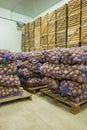 Close up view on bags of potato in storage house Royalty Free Stock Photo