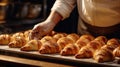 Close Up View Of Baker Preparing Golden Croissants For The Oven. Delicious Croissants Made By The Baker. Generative AI