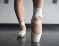 Close up view of a ballerina ballet dance, warming up her feet in ballet class Royalty Free Stock Photo