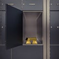 close up view on the bank vault deposit rack door is open with gold inside Royalty Free Stock Photo