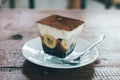 Close up view of Banoffee pie on the plate with wooden table