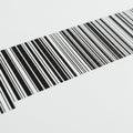 A close-up view of a barcode featuring a series of parallel black lines of varying widths