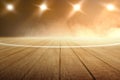 Close up view of a basketball court with wooden floor and spotlights