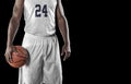 Close up view of Basketball Player on a black background Royalty Free Stock Photo