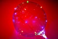 Close up view of beautiful balloon with colorful led lights on red background. Party / holidays background Royalty Free Stock Photo